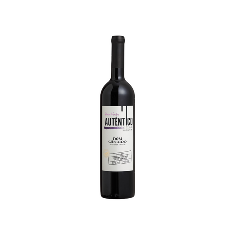 Garrafa do Dom Cândido Autêntico, com coloração rubi vibrante e rótulo elegante, perfeita para jantares descontraídos.
